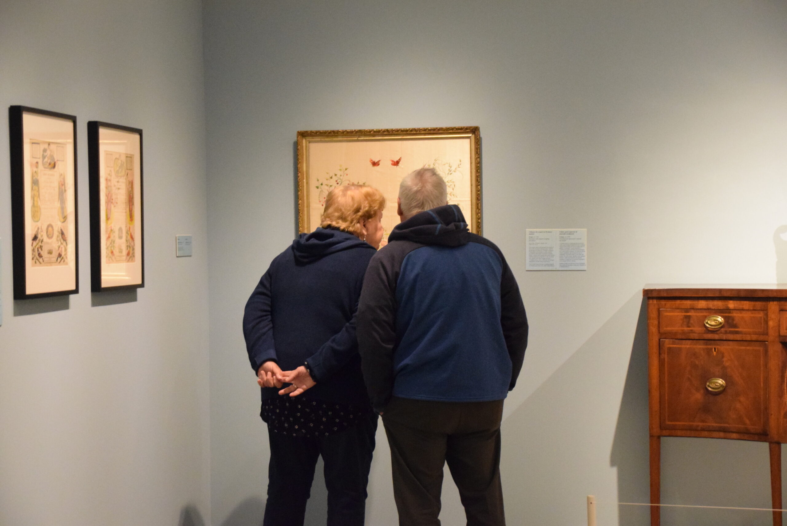People at Art Can looking at American art