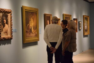 Docent discussing art with participants in Art Can